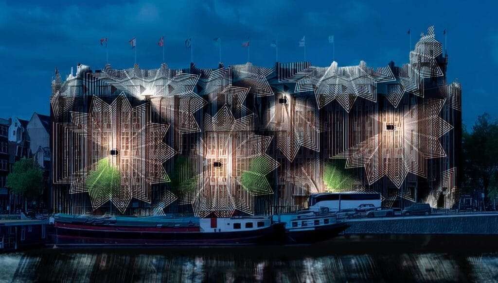 The Grand Amrath Hotel in Amsterdam during the 2024/2025 Light festival with projected artworks on the facade
